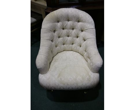 Victorian style armchair, with cream upholstered button back and seat, raised on turned legs and castors