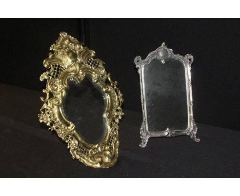 Brass dressing table mirror, the bevelled mirror plate housed in a pierced scroll decorated easel frame, 47cm high, white met