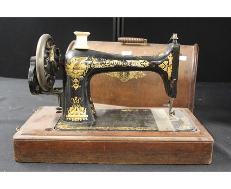 Singer manual sewing machine, housed in original domed case