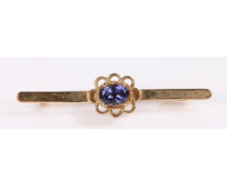 9 carat gold brooch, set with a blue stone, 2.8 grams