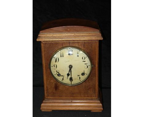 Mahogany cased mantel clock by William L Gilbert, Winsted, Conn USA, with arched case, the dial with Arabic numerals, 21cm wi