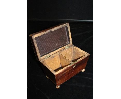 Regency style rosewood tea caddy, the gadrooned hinged lid opening to reveal two interior compartments, raised on orb feet, 1