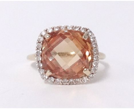 A 9ct citrine and diamond cluster ring.
