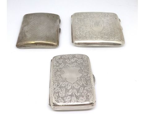 Three silver cigarette cases.