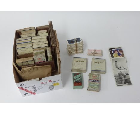 A collection of various cigarette cards including albums of Wills and Players.
