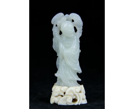 An antique Chinese white jade carving of standing robed figure on a ivory base carved with Lingzi fungus, height of figure 68