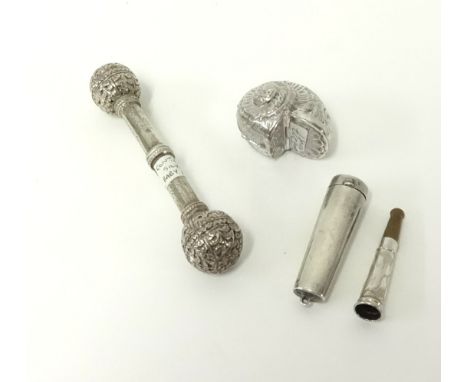 A novelty silver shell box, continental silver baby rattle and a silver cased cigarette holder.