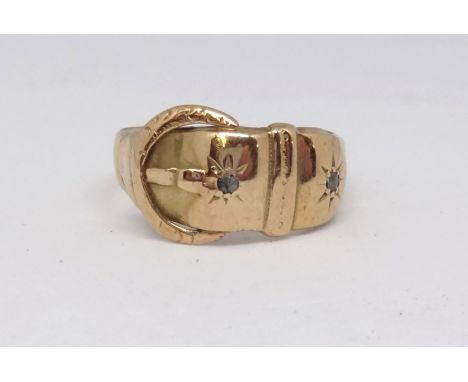 An antique 18ct buckle ring set with diamonds, 2.60g.