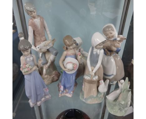 Four Nao porcelain figures, two Lladro figures and an unmarked figure of a young man with lambs. (7)