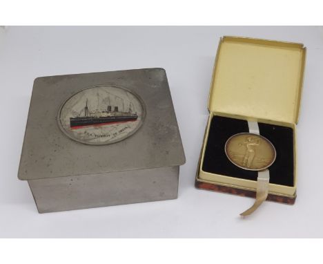 A small cigarette box with plaque of T.S.S.Viceroy of India together with a silver golfing medal presented by News of The Wor