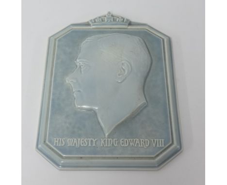 A Poole pottery wall plaque by Harold Brownsword, depicting a relief cast bust of 'His Majesty King Edward VIII', against a m