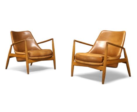 After Ib Kofod-Larsen (Danish 1921-2003), a pair of ‘Seal’ lounge chairs produced by Brdr Petersons Polstermobelfabrik c.2010