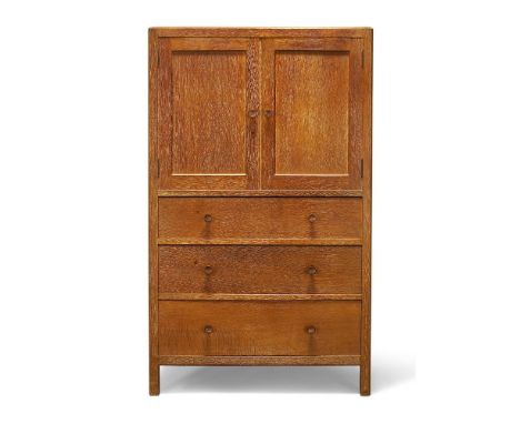 Heal & Son (British), a limed oak cabinet c.1930, one drawer inset with ivorine disc - 'Heal & Son Ltd, London. W' With two p