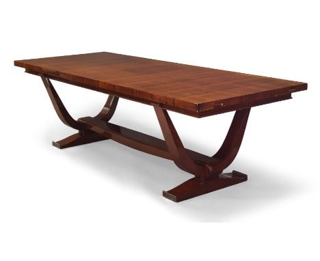 Attributed to Dominique (French), an Art Deco rosewood dining table  Circa 1930The table with two matching extension leaves, 