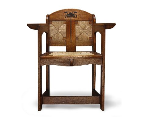 E.G. Punnett (British), and Art & Crafts inlaid oak and rush seated arm chair made by William Birch of High Wycombe c.1901 Th