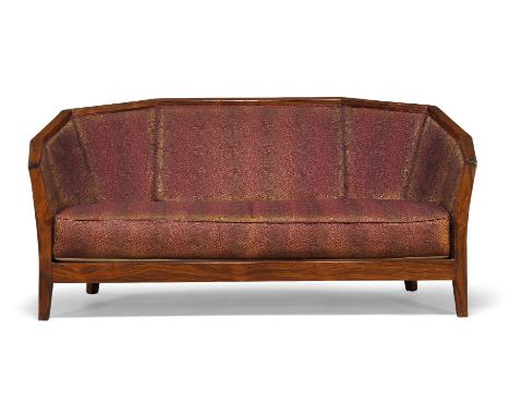 Art Deco, a rosewood two seater sofa, in the manner of Pierre Chareau  Early 20th Century  With shaped backrest, upholstered 