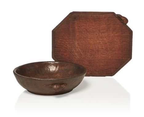 Robert Thompson (British 1876-1955), a 'Mouseman' oak bowl and cheeseboard c.1935, each signed in relief with a mouse The bow