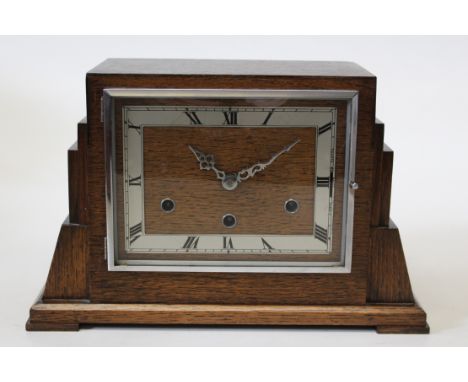 An oak cased Art Deco mantel clock with a three train movement, height 23cm