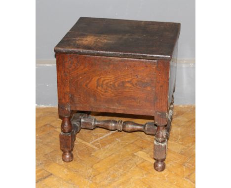 A part 18th century oak box commode, raised on turned and block supports, 56 x 43 x 46cm