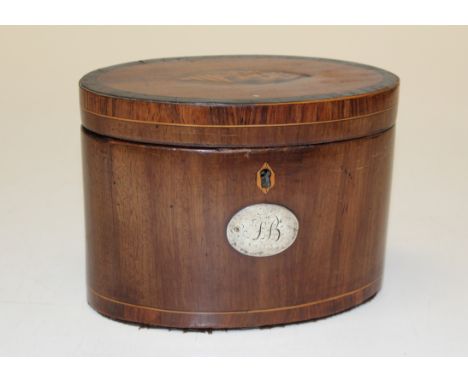 A George III inlaid mahogany oval tea caddy, lead lined interior, the cover inlaid with conch shell decoration, stringing, th
