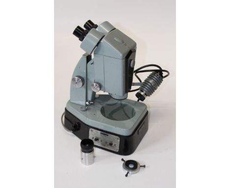 A Watson enamel finished binocular optical microscope