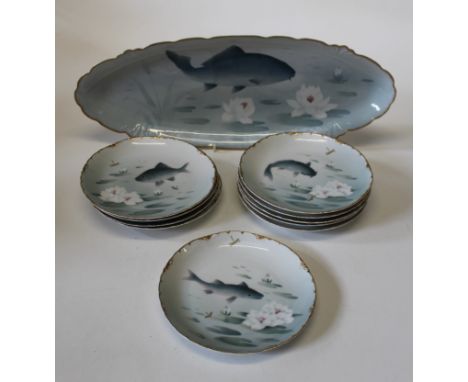 A Rosenthal '' Versailles''&nbsp; part table set decorated with fishes, serving dish, width 58cm, plates 23cm diameter each