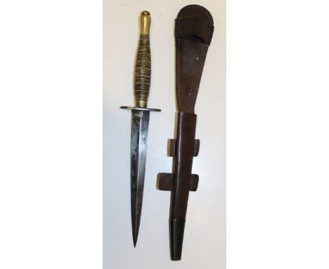A WWII Commando fighting knife with ribbed beaded hilt, arrow / number acceptance mark and diamond section 17.5 cm blade. In 