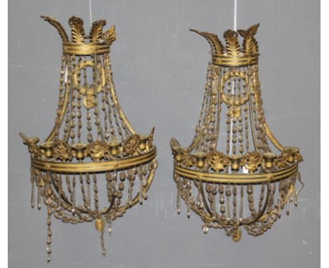 A pair of Empire style gilt metal five light wall appliques of baguette shape hung with faceted glass drops, height 72cm