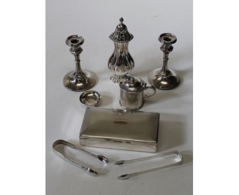 A pair of modern loaded silver dwarf candlesticks, Birmingham 1911, height 13cm each, a large silver fluted baluster caster, 