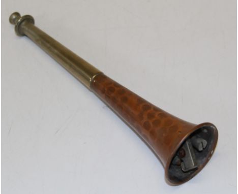 An unusual Dunhill novelty cigarette lighter, the mechanism mounted in a hammered copper hunting horn, length 25cm