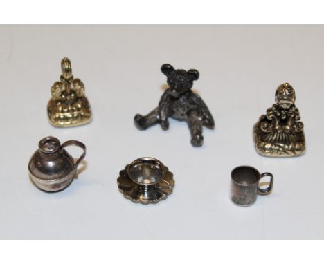 Two Victorian gilt metal fob seals, one with Forget Me Not intaglio, together with a miniature silver bear, churn, bowl and m