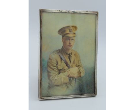 xxx Potter ( English School) A portrait miniature of a British First War Officer, Devonshire Regiment. Half length, with arms