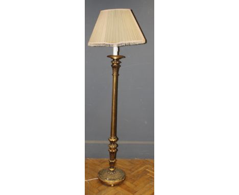 A 20th century gilt composite Italianate standard lamp with comical shade. 156cm (excluding fittings) 