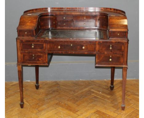 A late Georgian period Carlton House mahogany ladies writing desk with bottle green leather pull out writing surface, rounded