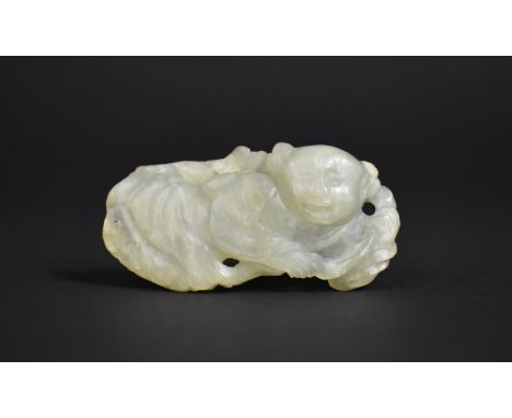 A Chinese Carved Jade Item, Immortal, 7cms Wide. Condition: Not Perfect with Chips and Nicks 