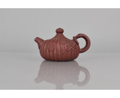 A Chinese Yixing Teapot or Reeded Form, Decorated in relief with Flowers and Stylised Bamboo Handle and Leaf Spout, Seal Mark