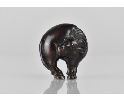 A Japanese Netsuke in the Form of a Goat, Signed, 4cms High 