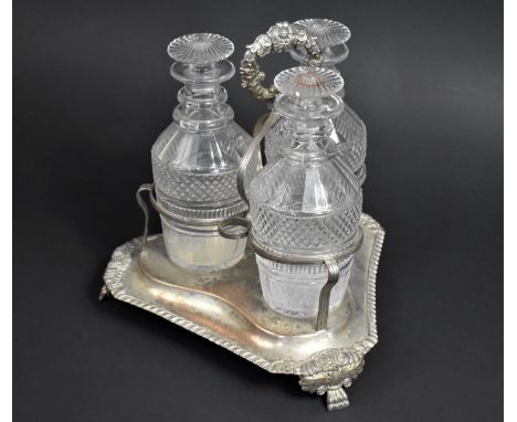 A Georgian Three Bottle Tantalus on Silver Plated Stand, Glass Bottles of Mallet Form having Cut Hobnail Design, The Stand of