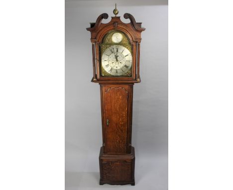 A 19th Century Oak Longcase Clock with Reeded Quarter Pilasters and having Arched Brass Dial with Gilt Spandrels and Silvered