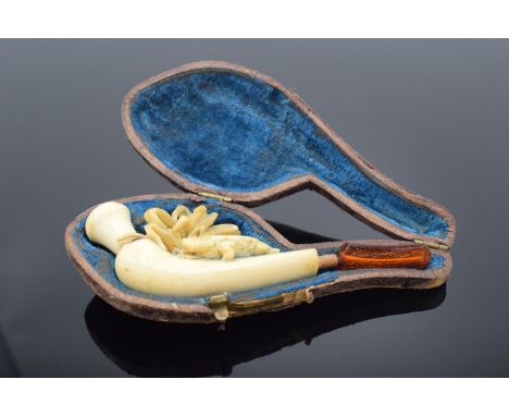 Cased meerschaum pipe with a turtle decoration. The mouth piece is a/f and there is damage to the decor on the pipe itself. 