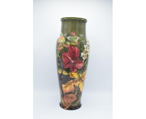 Doulton Lambeth Faience vase with a floral design, initialled MW- Minnie Webb, 48cm tall. The item had age related crazing pr