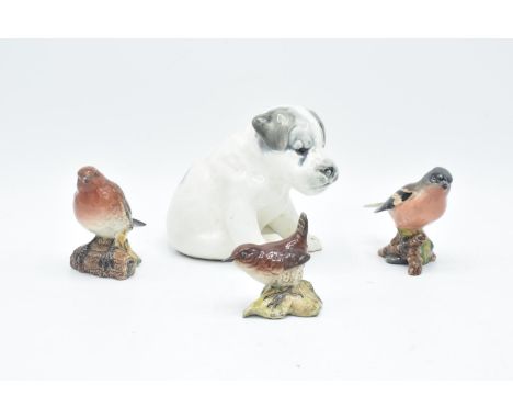 A collection of Beswick birds to include a Chaffinch 991, Wren 993, Robin 980 and a USSR Zik Konakovo 1960s model of a puppy 