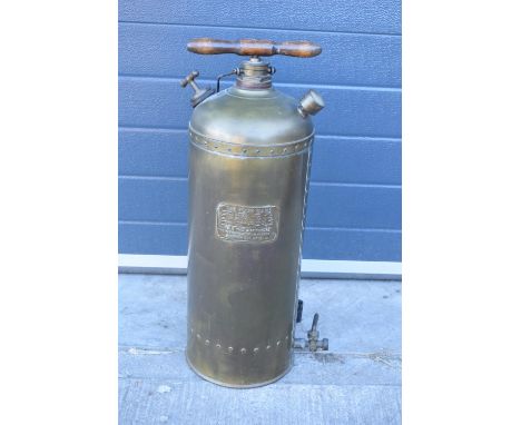 The Four Oaks Spraying Machine garden equipment. In good condition, decorative item only. The hands have fallen off the small
