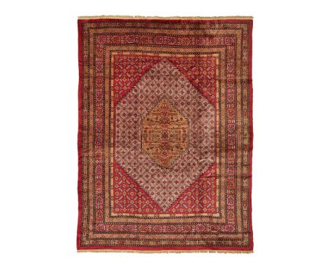  EAST TURKESTAN, MID/LATE 20TH CENTURY the light purple field with camel medallion, red spandrels, within multiple borders 39