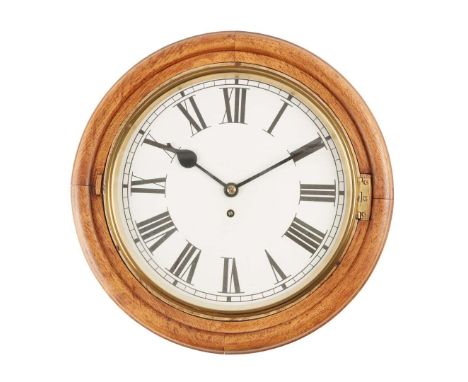  OAK ROUND-DIAL WALL CLOCK EARLY 20TH CENTURY the printed facsimile&nbsp;pasted over a cream enamel dial, with Roman numerals