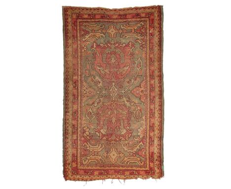  WEST ANATOLIA, LATE 19TH/EARLY 20TH CENTURY the light blue field with two salmon pink palmettes, within salmon pink border 2