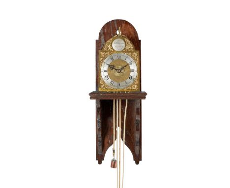  18TH CENTURY the breakarch brass dial with silvered chapter ring with Roman numerals and pierced spandrels, signed on a silv