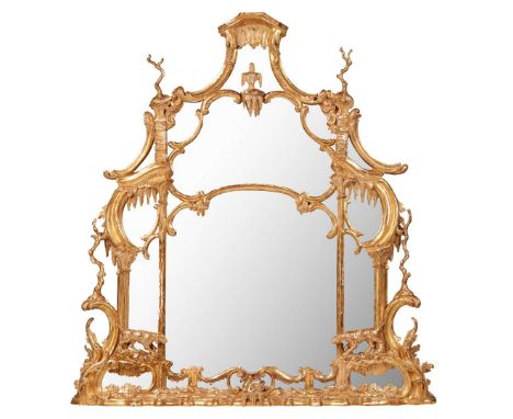 GEORGE III GILTWOOD OVERMANTEL MIRROR 18TH CENTURY the shaped and arched divided mirror plate in a moulded frame carved with 