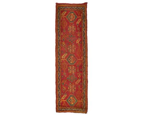  WEST ANATOLIA, LATE 19TH/EARLY 20TH CENTURY the red field with multiple turquoise and light blue medallions, within narrow t