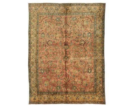  NORTHWEST PERSIA, MODERN the light red field with allover palmette and scrolling vine pattern, within lemon border 375cm x 2